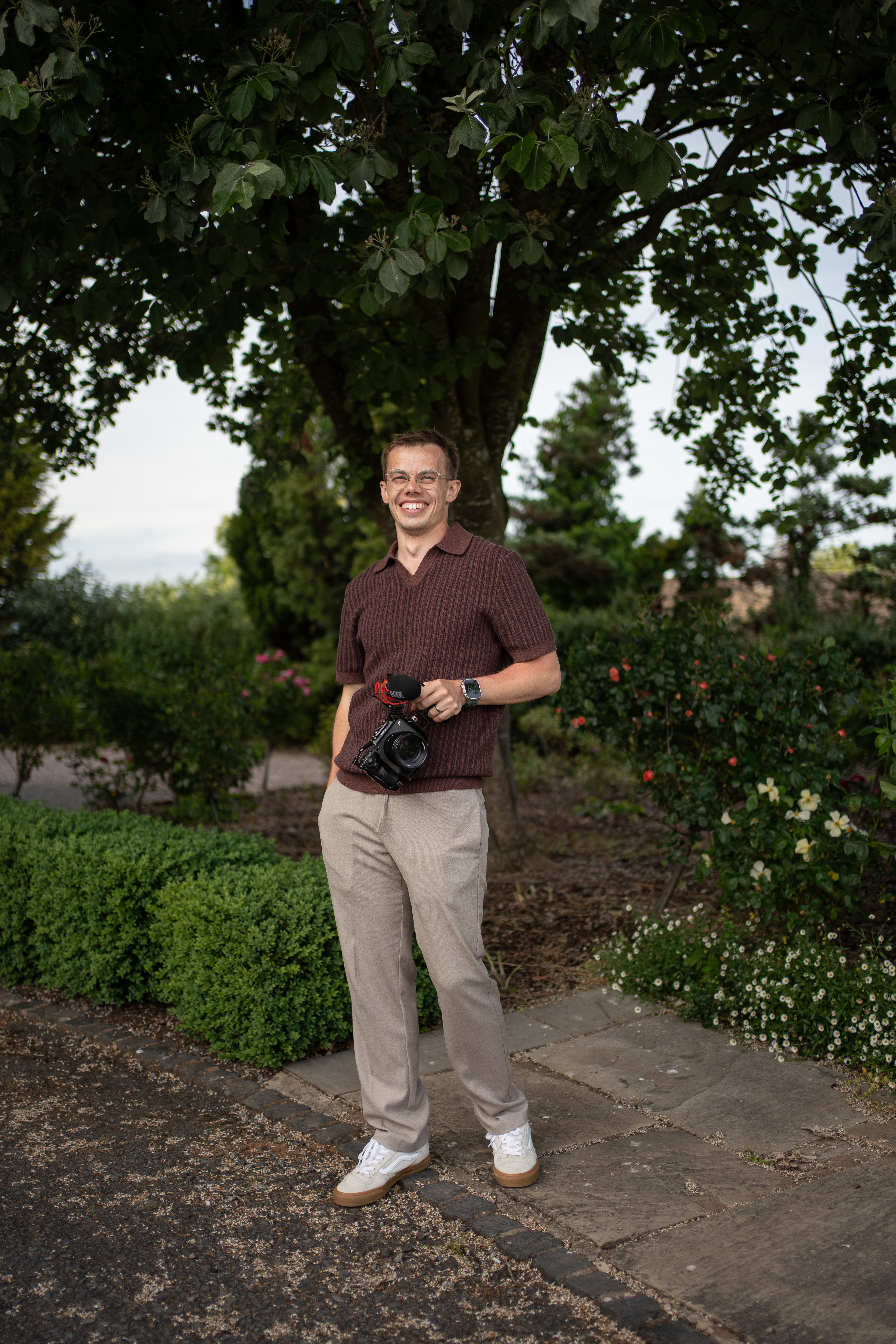 Luke, wedding filmmaker, camera in hand